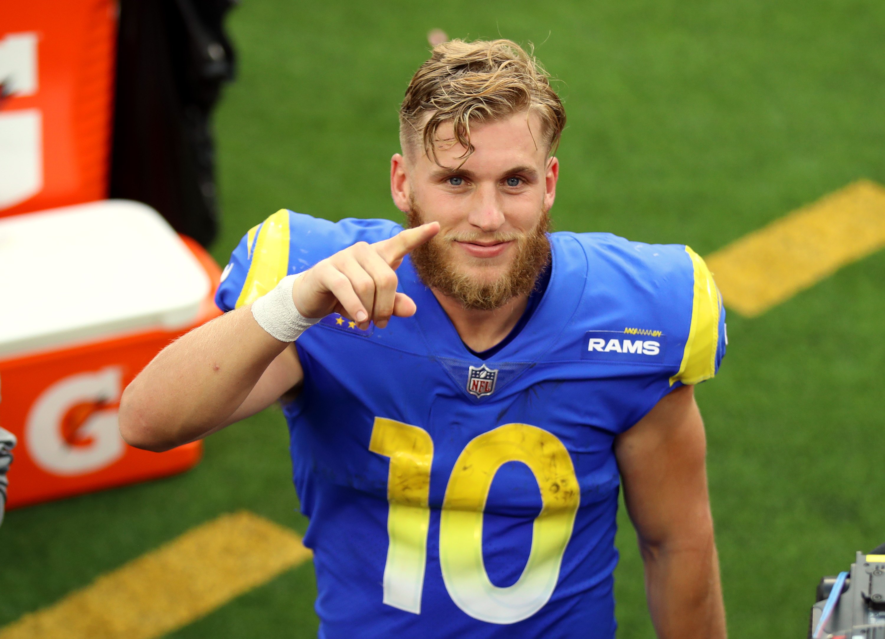 Cooper Kupp puts his finger up as he celebrates a win after a game against the Detroit Lions