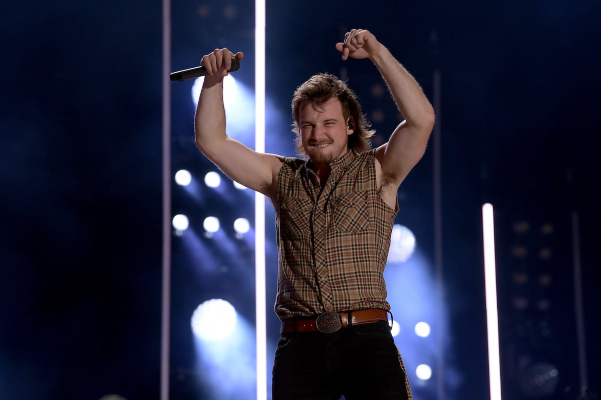 Country singer Morgan Wallen gestures at fans while performing on stage during the 2019 CMA Music Festival