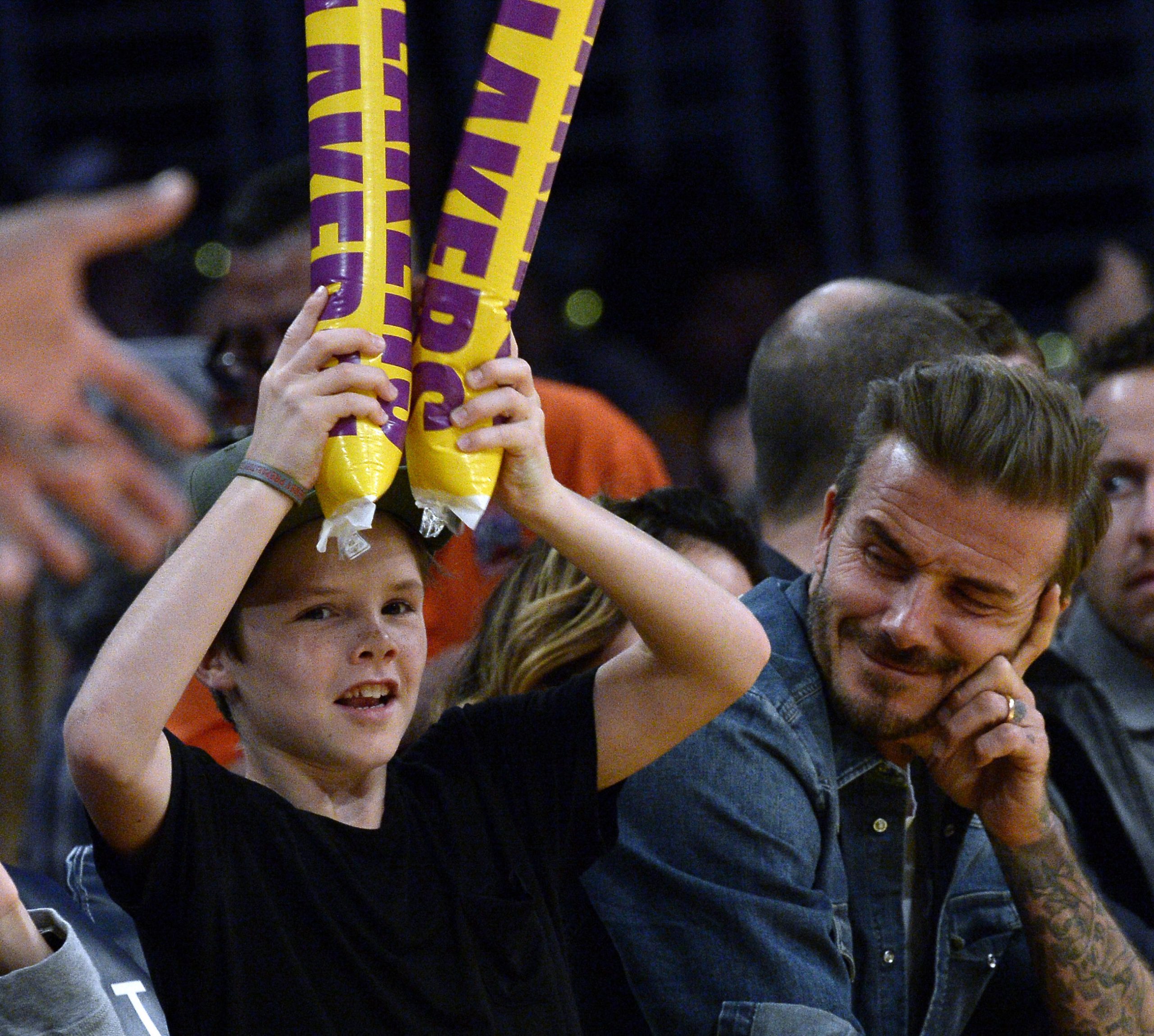 Cruz Beckham and his father David Beckham