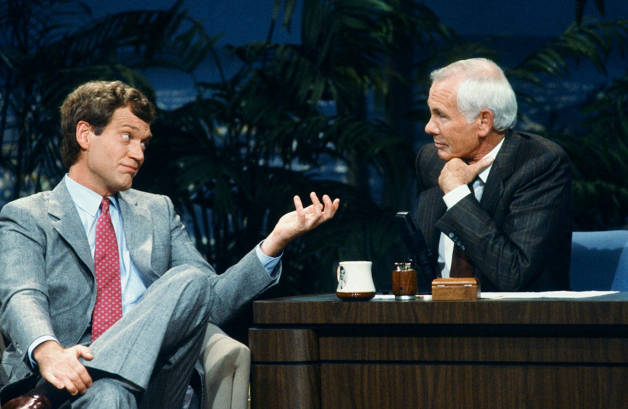 David Letterman in the guest chair and host Johnny Carson behind the desk on 'The Tonight Show' on Oct. 23, 1987