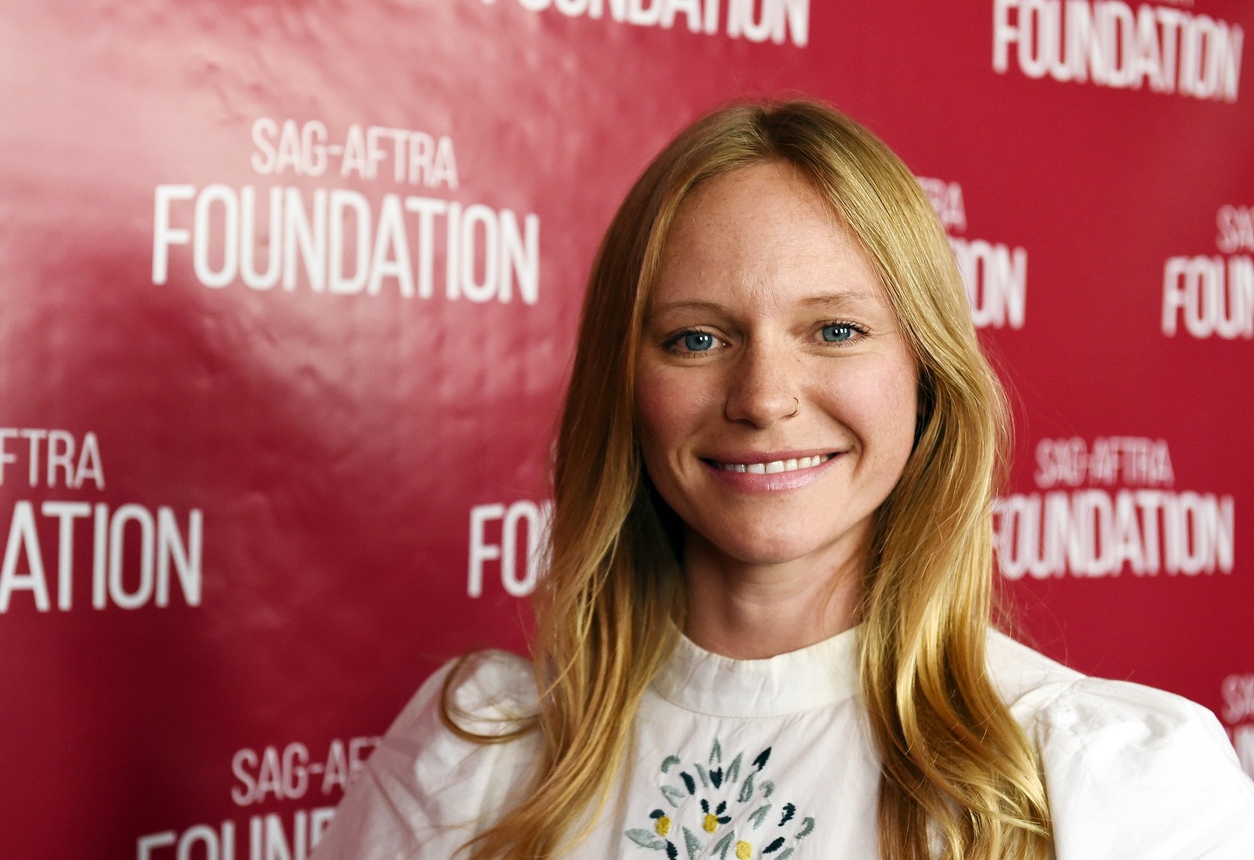 Days of Our Lives star Marci Miller in a white shirt with floral pattern