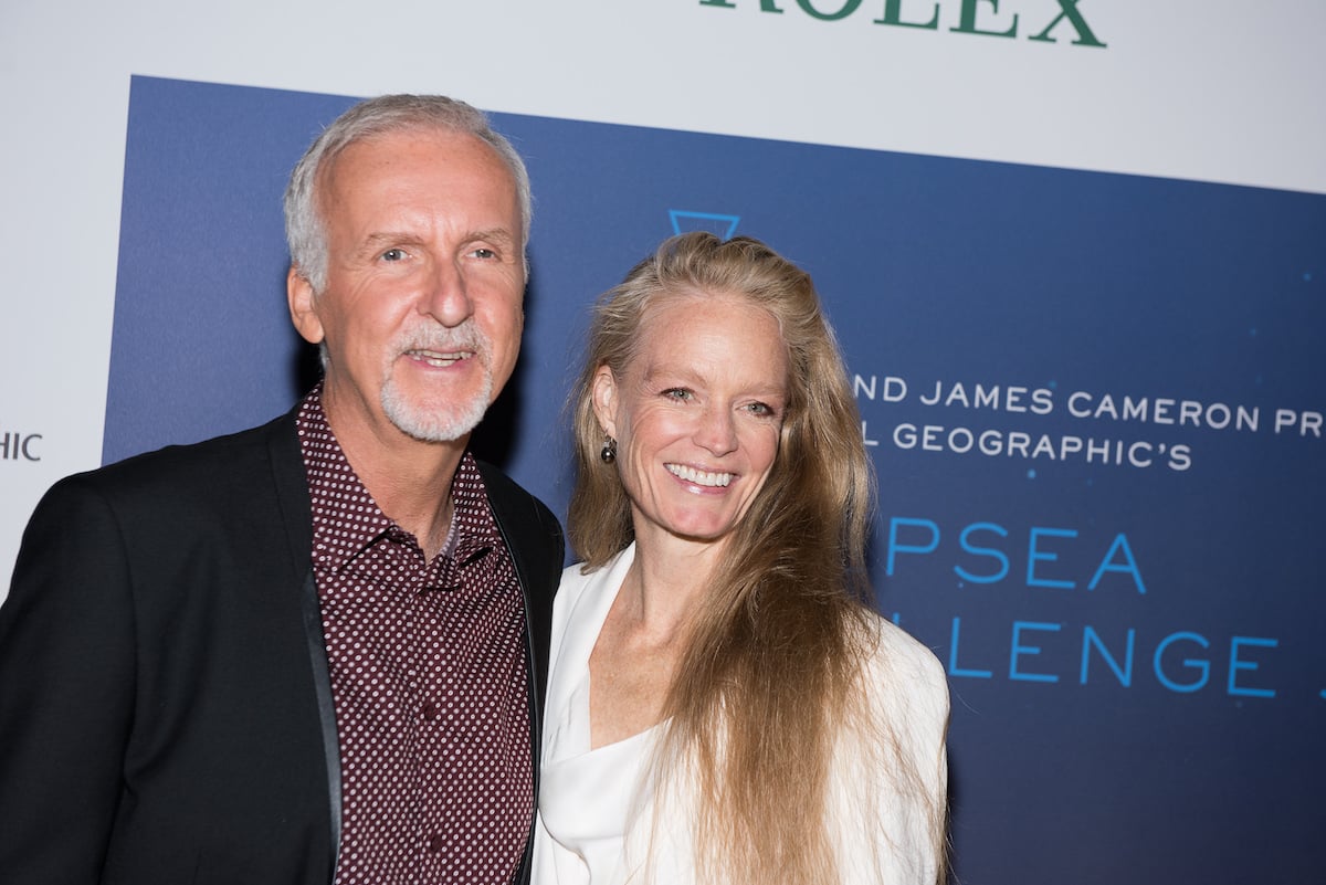 James Cameron and his wife Suzy Amis pose for photos at the 'Deepsea Challenge 3D' New York Premiere