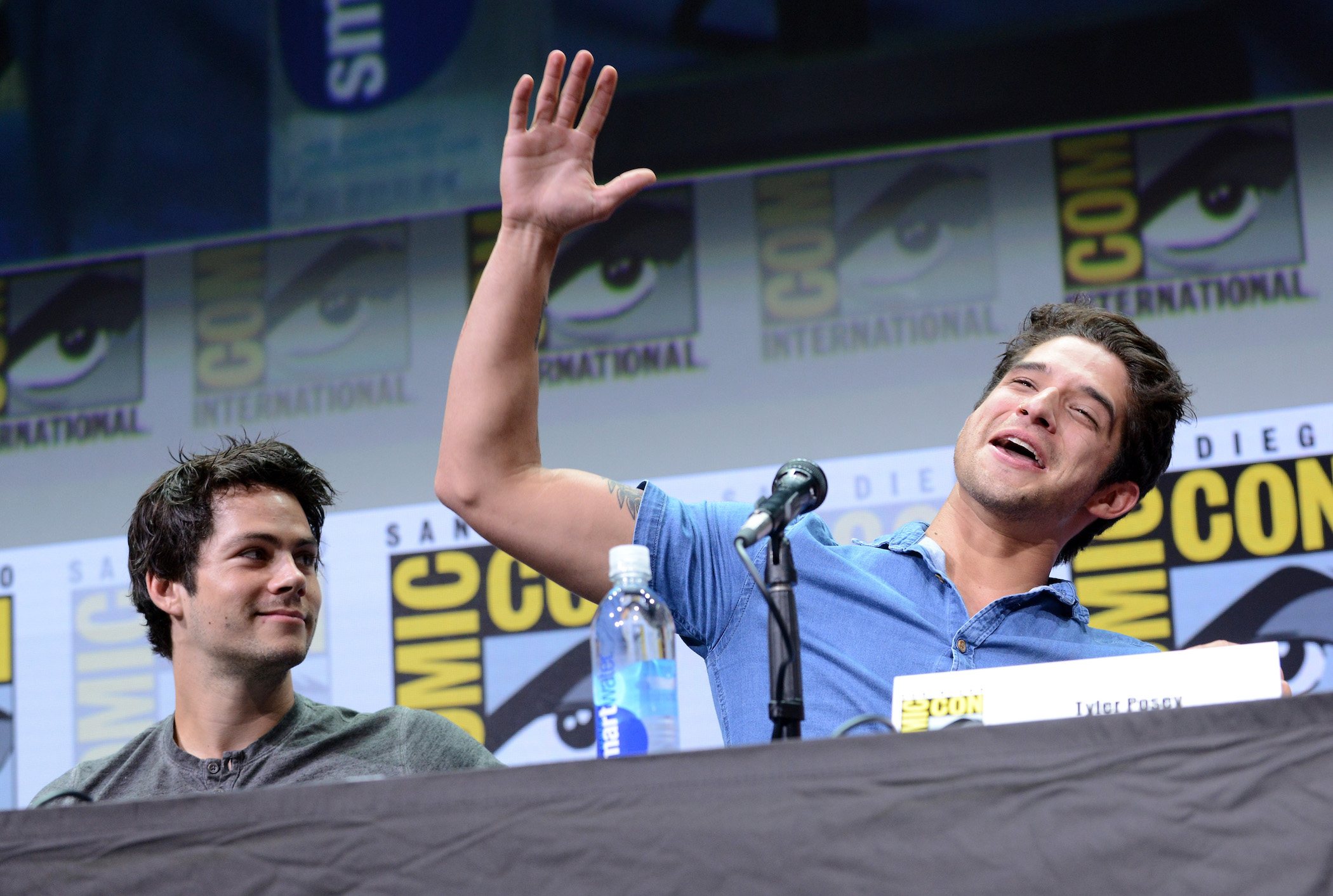 Actors Dylan O'Brien (L) and Tyler Posey from the 'Teen Wolf' cast speaking at a panel