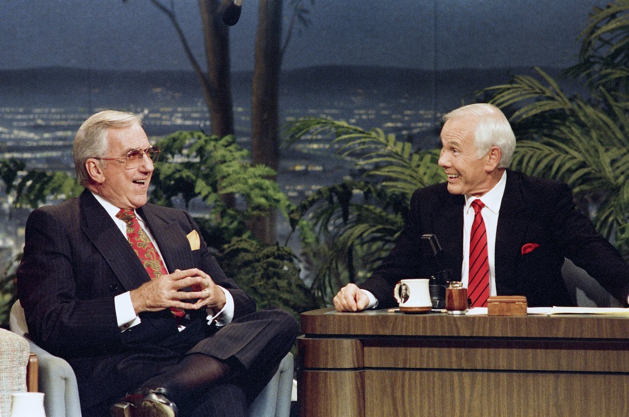 Ed McMahon sits next to Johnny Carson, both smiling, during the taping of their final 'Tonight Show' in 1992