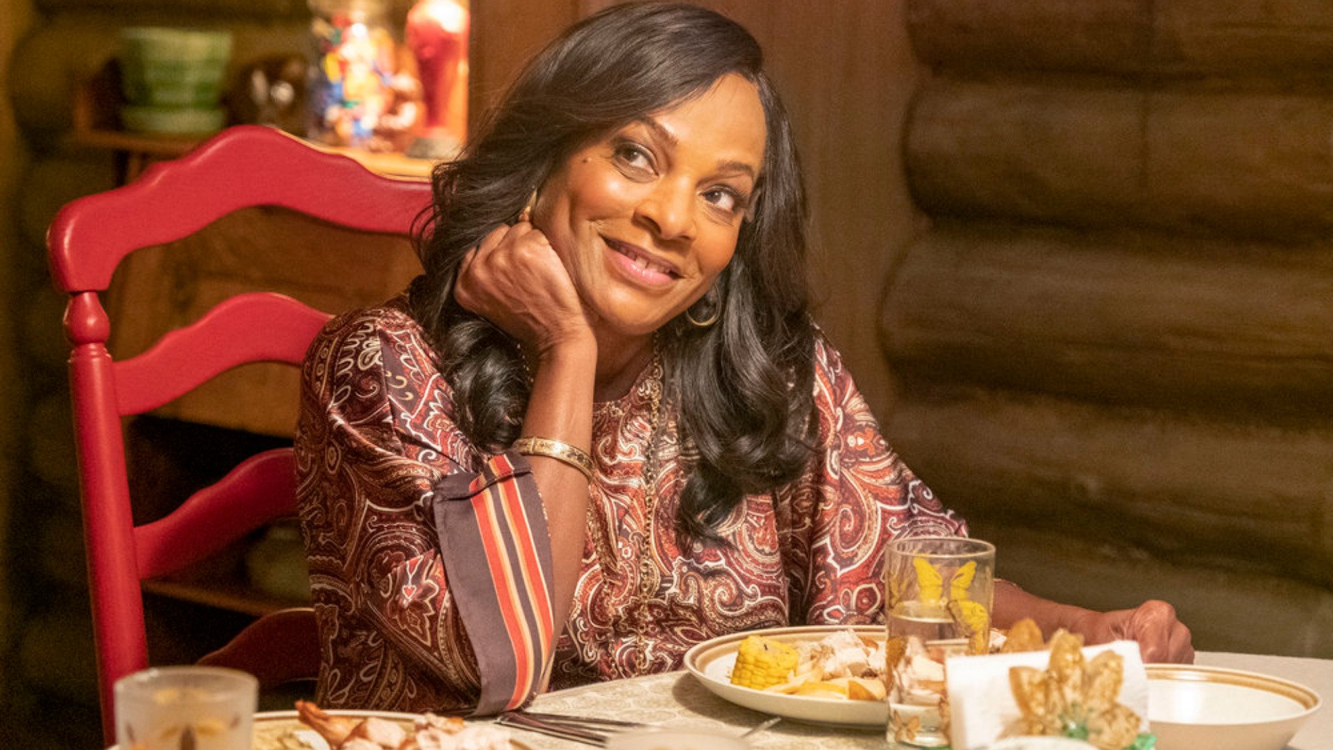 Vanessa Bell Calloway as Nicky’s wife Edie smiling at dinner in ‘This Is Us’ Season 6