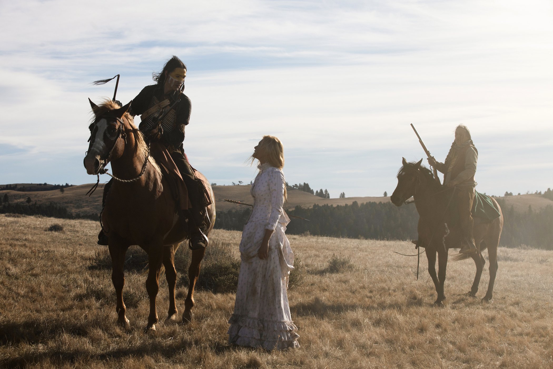 Elsa Dutton with an arrow through her midsection talking to a Native American on a horse in '1883' episode 9