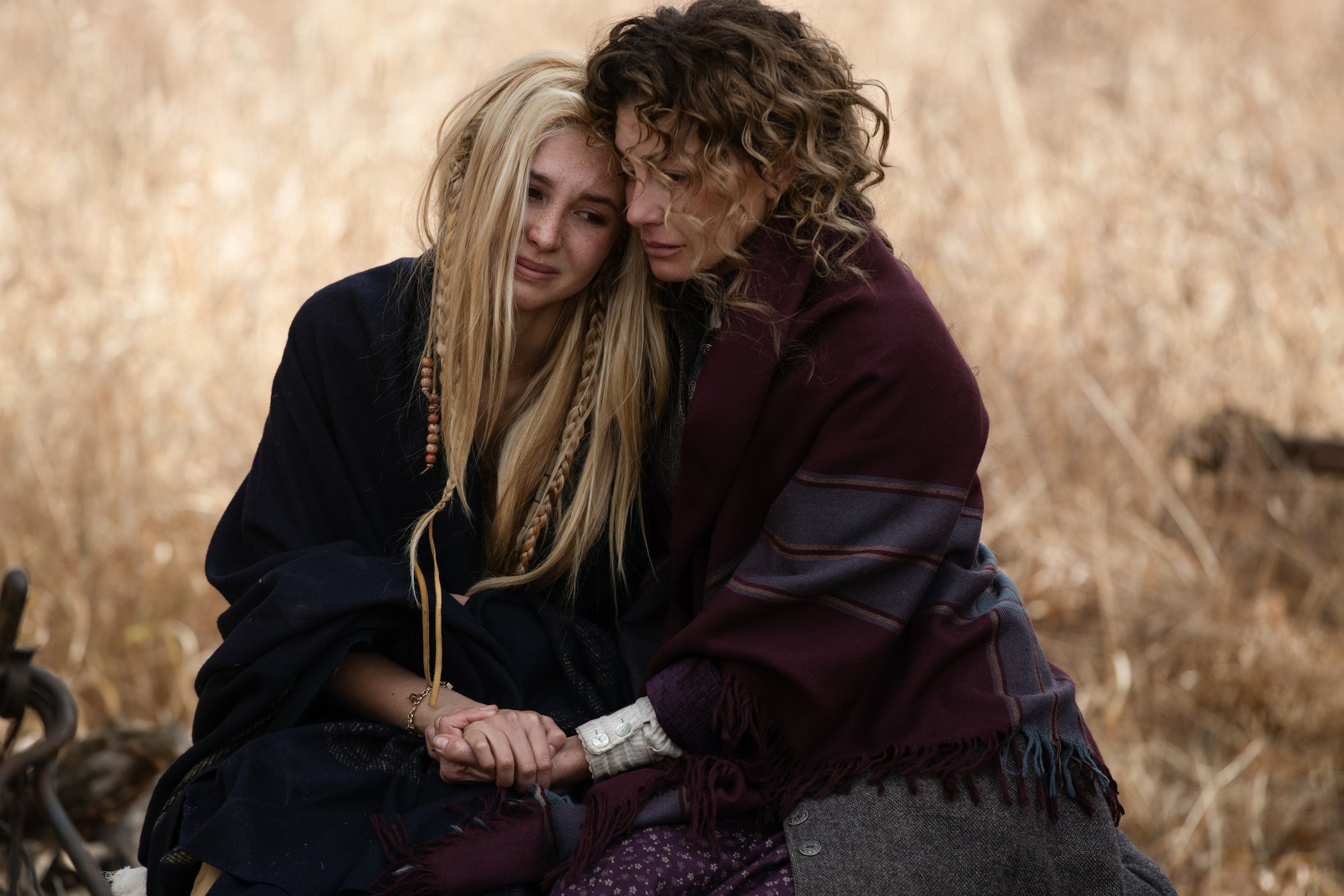Isabel May as Elsa Dutton and Faith Hill as Margaret Dutton holding each other in '1883' episode 10