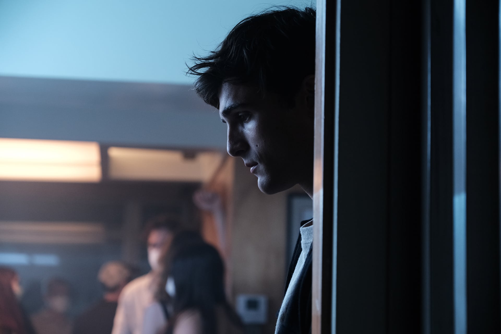 'Euphoria' star Jacob Elordi as Nate Jacbos standing next to a wall in a production still from season 2. 'Euphoria' fans have started to speculate about a third Jacobs brother once again after seeing a family photo with three sons.