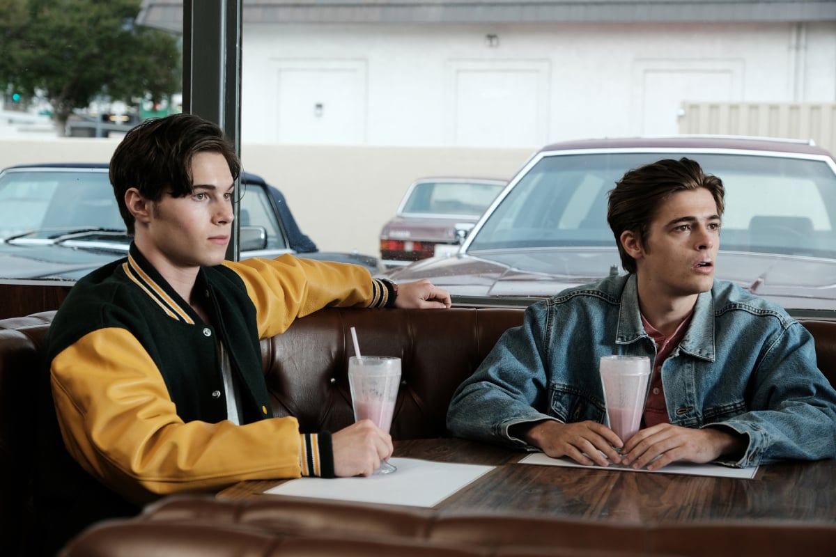 Elias Kacavas as Cal and Henry Eikenberry as Derek in Euphoria Season 2. Cal and Derek sit at a diner with milkshakes in front of them.