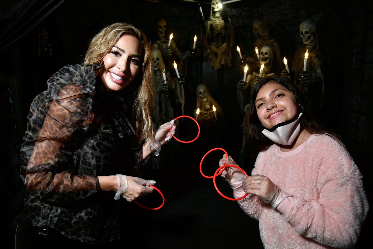 Farrah Abraham and daughter Sophia smiling at the "Icons Of Darkness" exhibition
