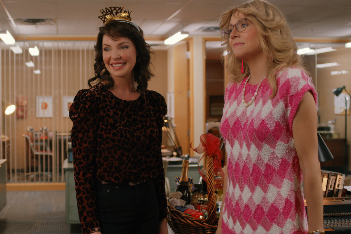 Katherine Heigl, wearing a Happy New Year headband, and Sarah Chalke, wearing a pink and white dress, in 'Firefly Lane'
