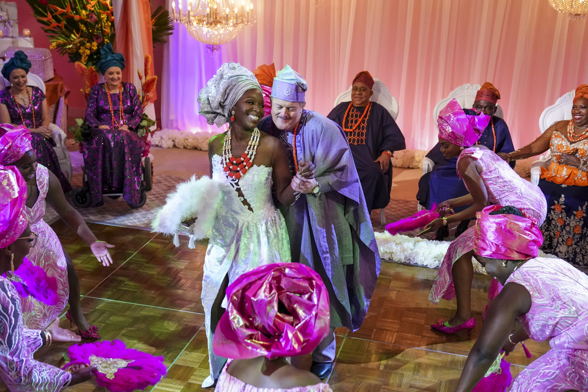 Folake Olowofoyeku wearing the 'Bob Hearts Abishola' wedding dress with Billy Gardell as Abishola and Bob