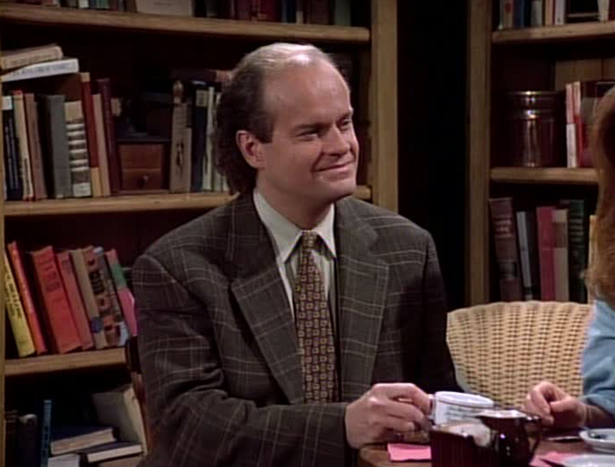 'Frasier': Kelsey Grammer sits with a cup of tea in front of bookshelves