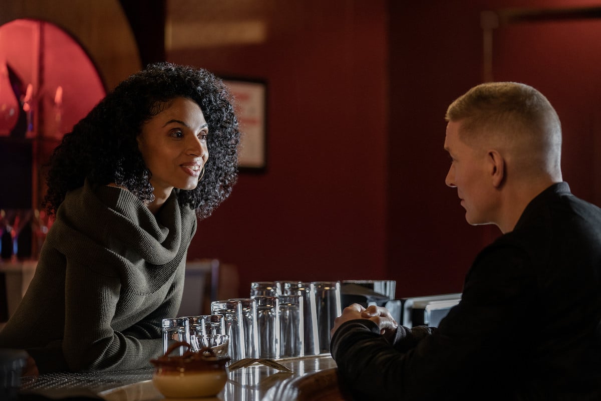 Gabrielle Ryan as Glora and Joseph Sikora as Tommy chatting at a bar in 'Power Book IV: Force'