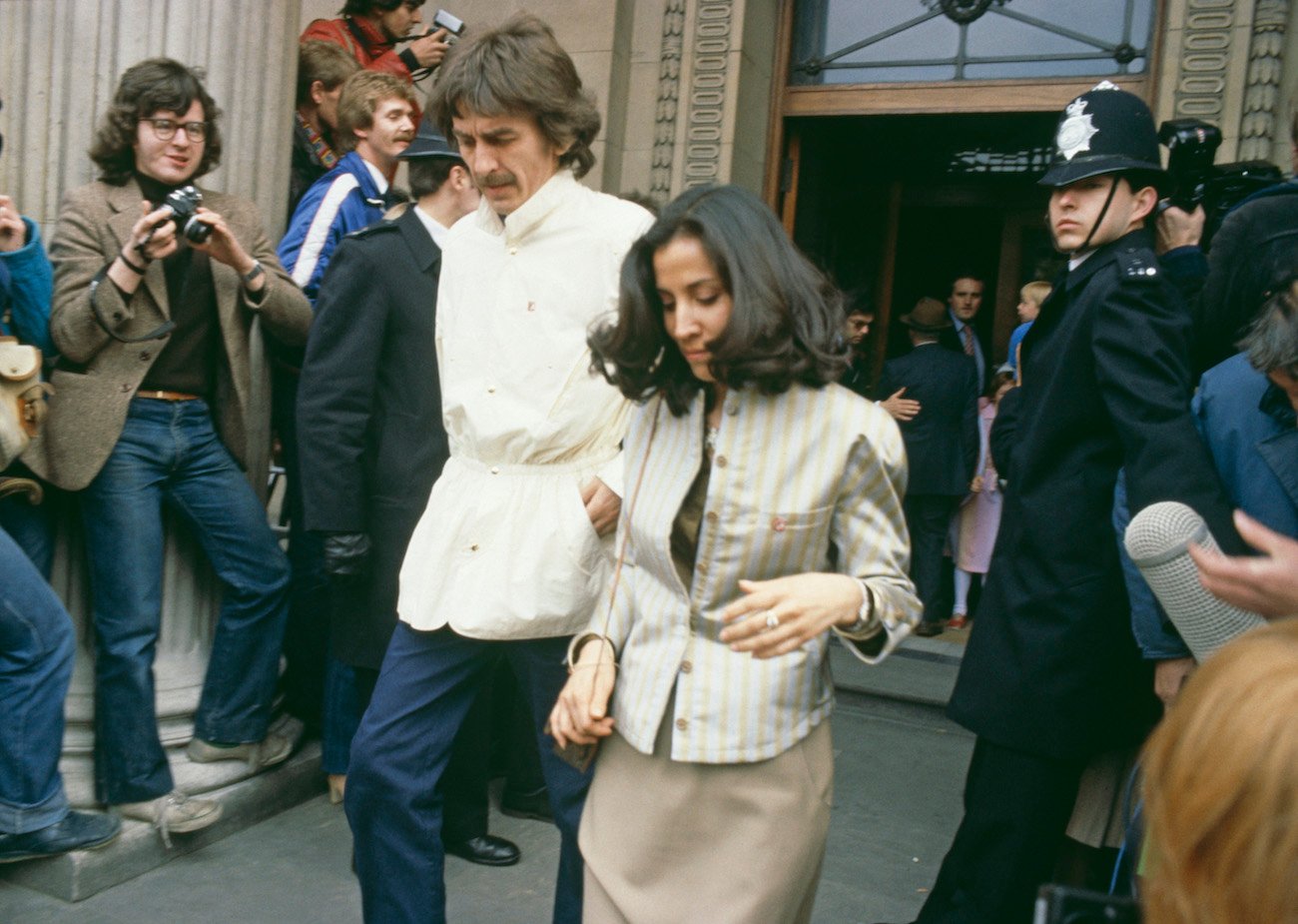 George Harrison and his wife, Olivia, coming out of the Marylebone Register Office after Ringo Starr and Barbara Bach got married in 1981.