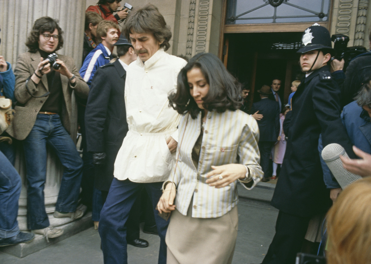 George Harrison and his wife, Olivia, coming out of the Marylebone Register Office after Ringo Starr and Barbara Bach got married in 1981.