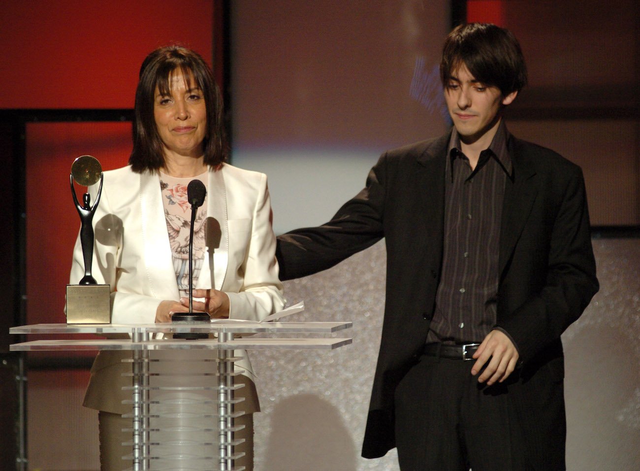 George Harrison's son, Dhani Harrison, and his wife, Olivia Harrison during George's induction into the Rock & Roll Hall of Fame in 2004.