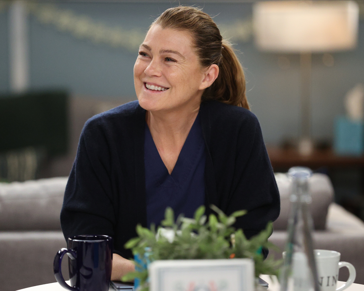 Grey’s Anatomy star Ellen Pompeo smiling in scrubs as Meredith Grey