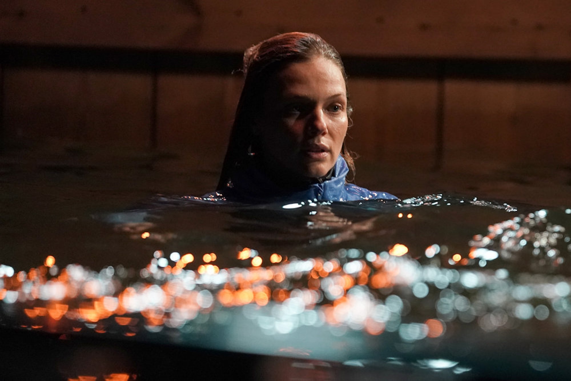 A close-up of Hailey Upton in a river at night in 'Chicago P.D.' Season 9 Episode 13