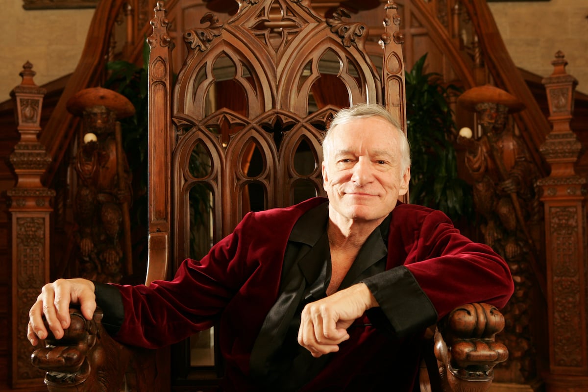 Hugh Hefner net worth: Playboy founder Hugh Hefner poses in a dark-red robe on a throne on Nov. 17, 2005