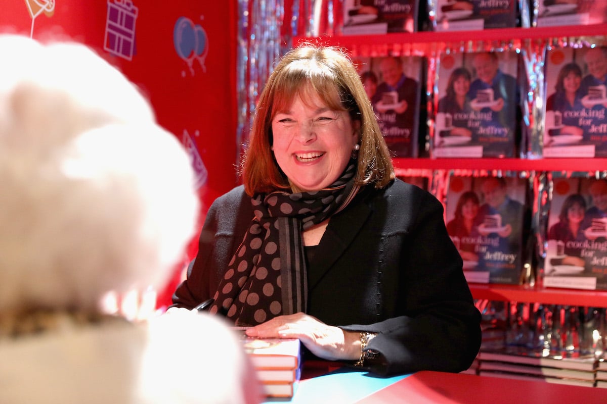 Ina Garten smiles as she greets a fan at a book signing