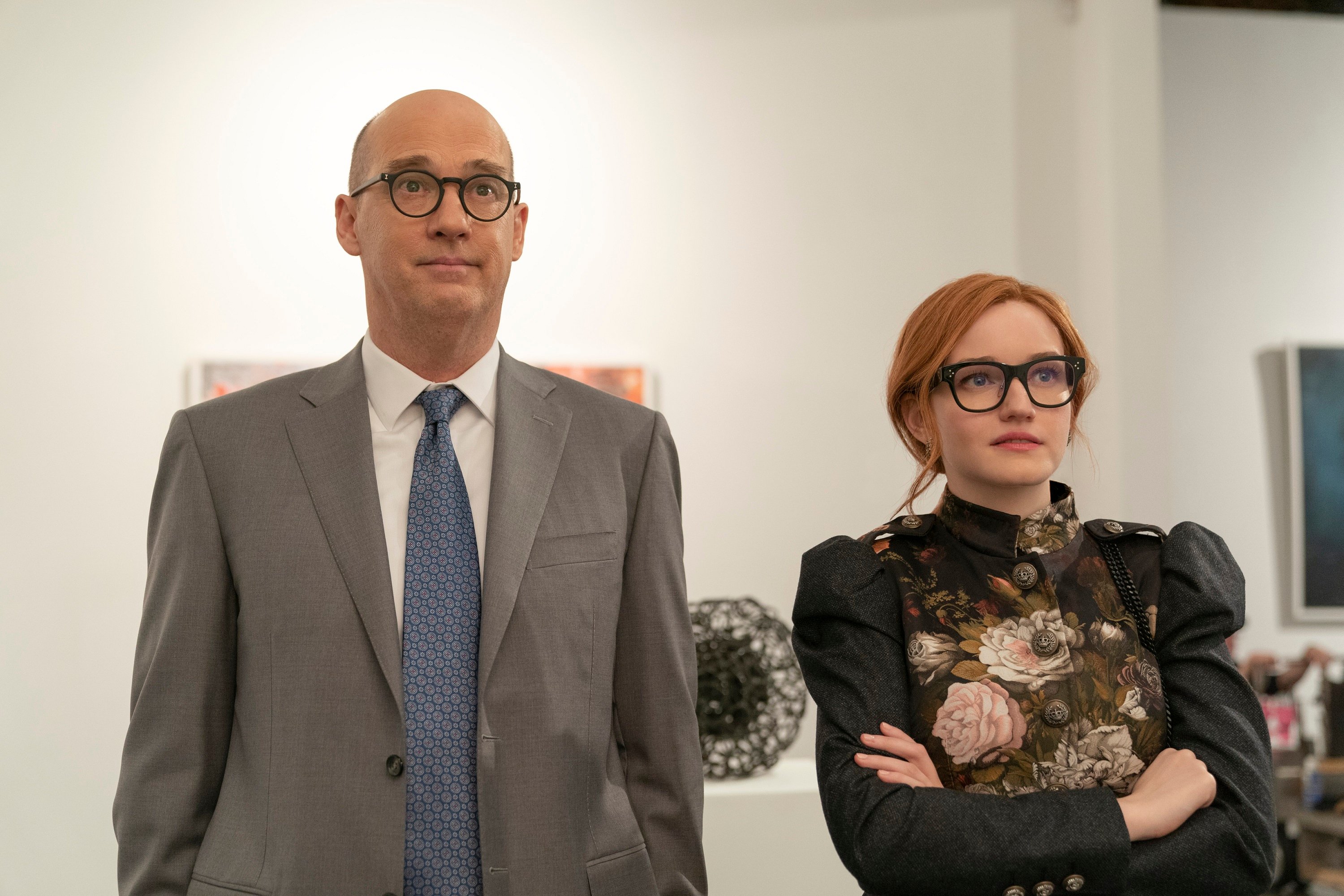 'Inventing Anna' Anthony Edwards plays Alan Reed and Julia Garner plays Anna Delvey as the two stand next to each other looking straight ahead