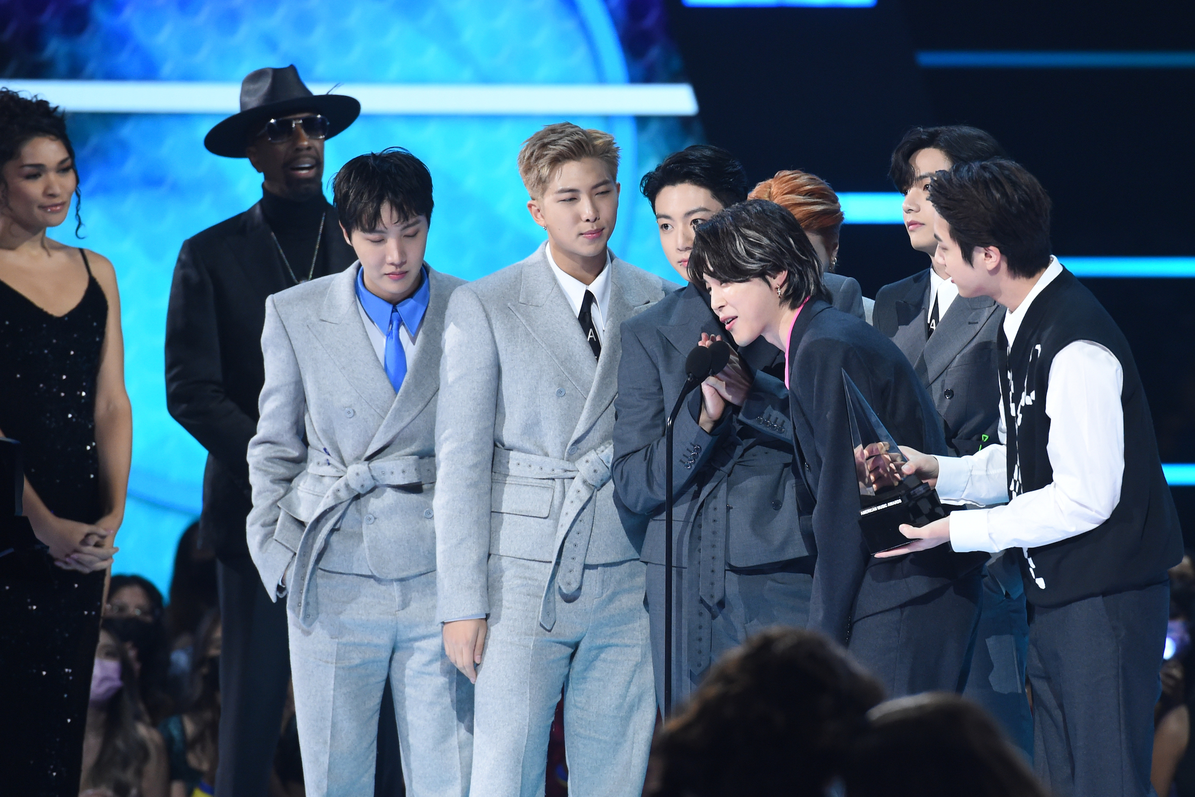 Jimin of BTS speaks at the American Music Awards (AMAs) alongside J-Hope, RM, Suga, V, Jungkook, and Jin