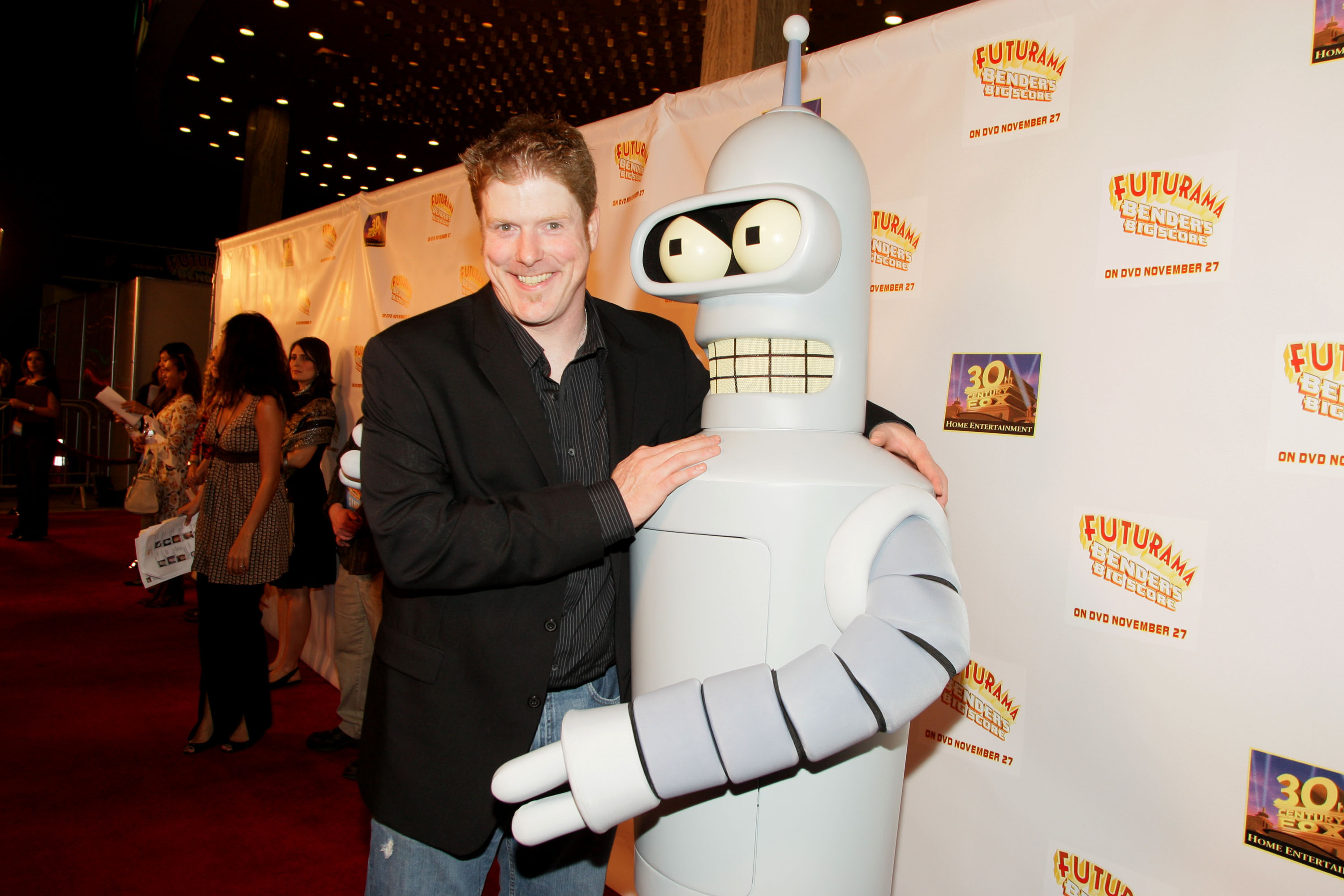 'Futurama' star John DiMaggio poses with a mascot of Bender the Robot.