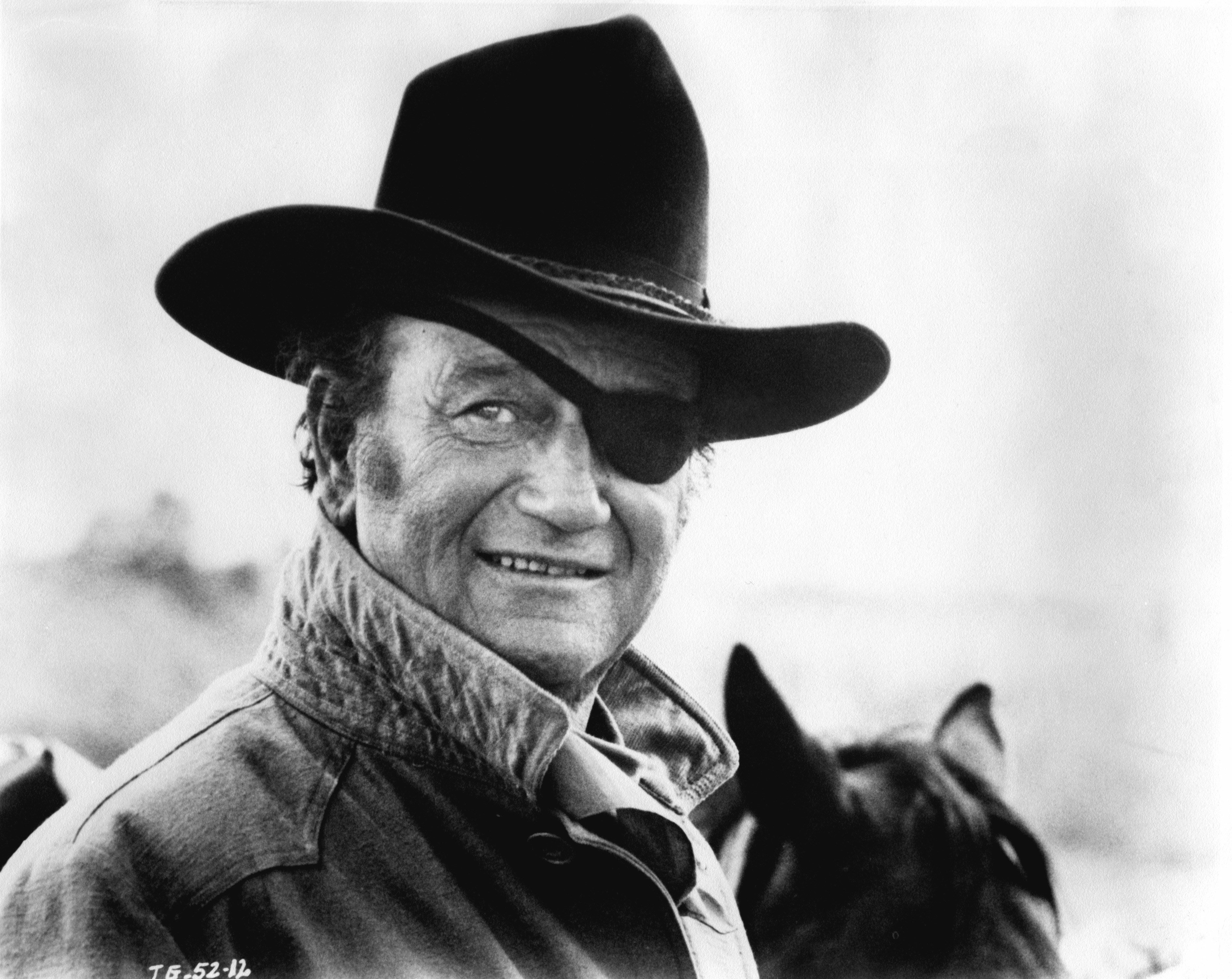 John Wayne wearing a cowboy hat and an eye patch