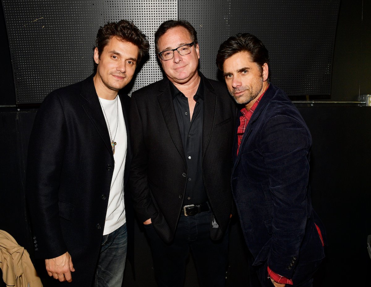 John Mayer, Bob Saget, and John Stamos pose together at an event.