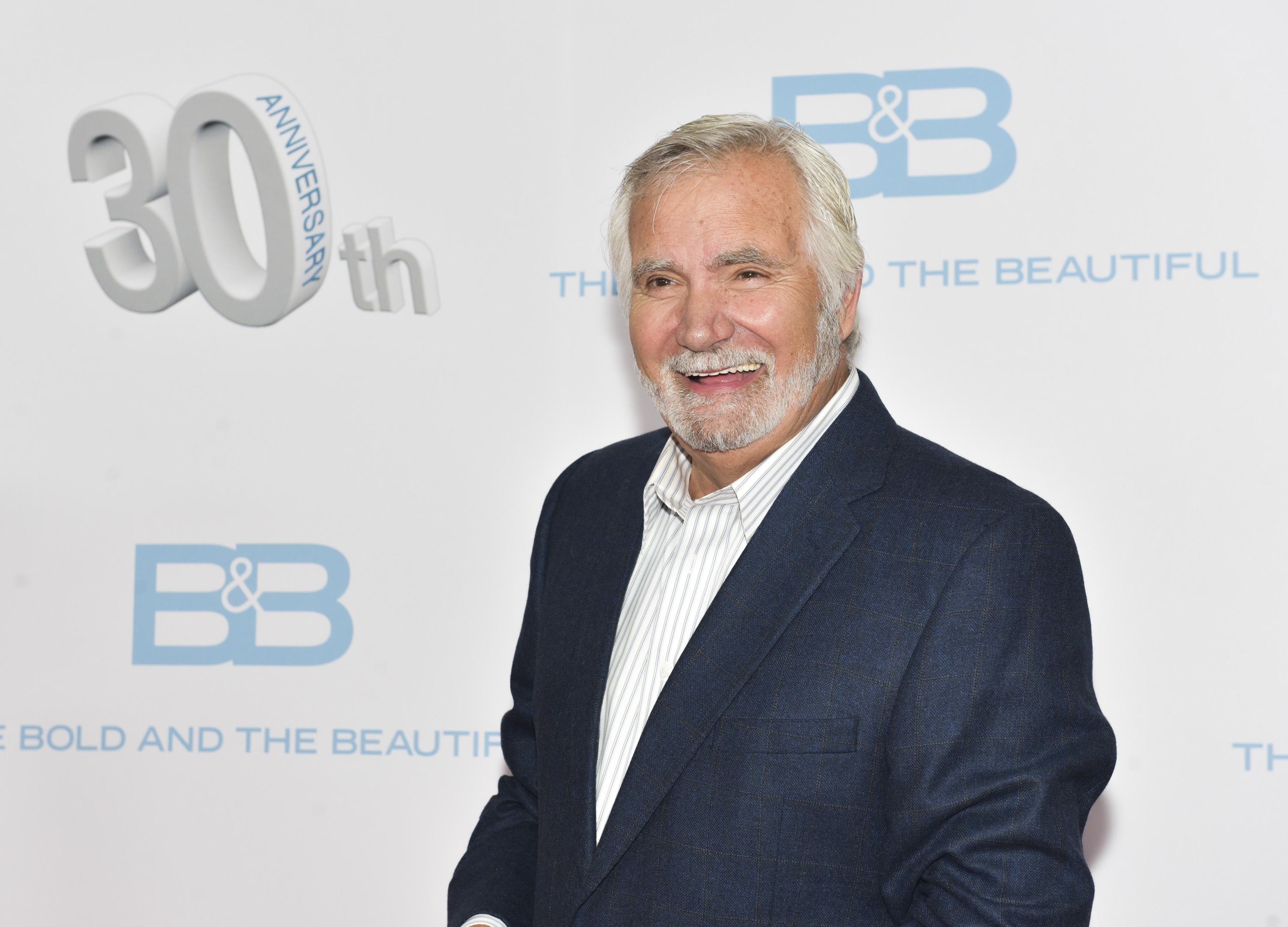 'The Bold and the Beautiful' actor John McCook wearing a blue suit and a white shirt during the show's anniversary party.