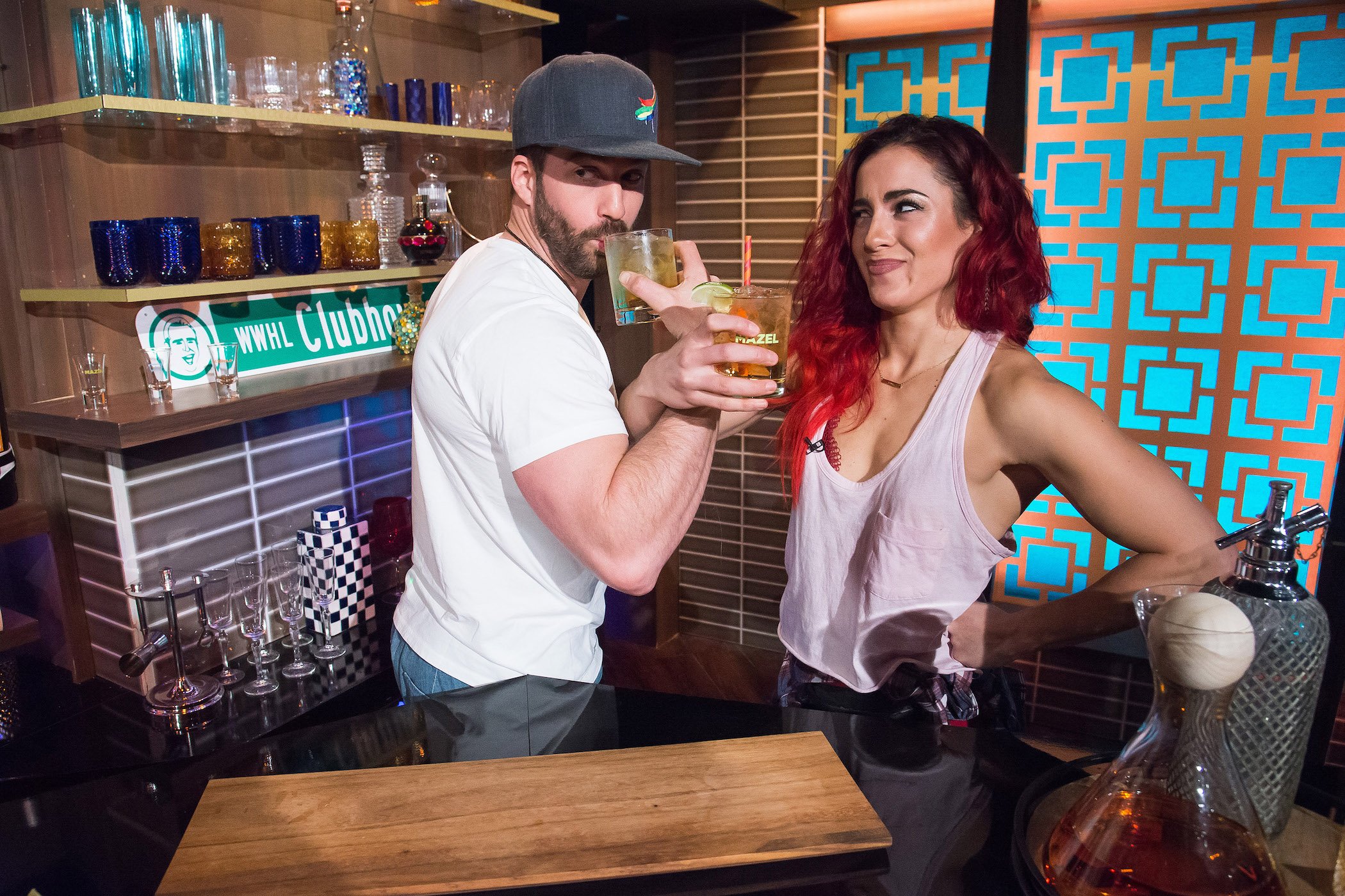 Johnny 'Bananas' Devenanzio and Cara Maria Sorbello from MTV's 'The Challenge' drinking together in a celebrity kitchen