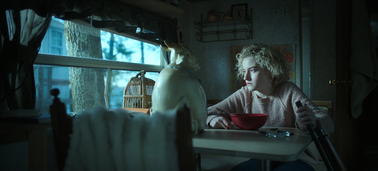 Julia Garner as Ruth Langmore sitting in a trailer in 'Ozark'