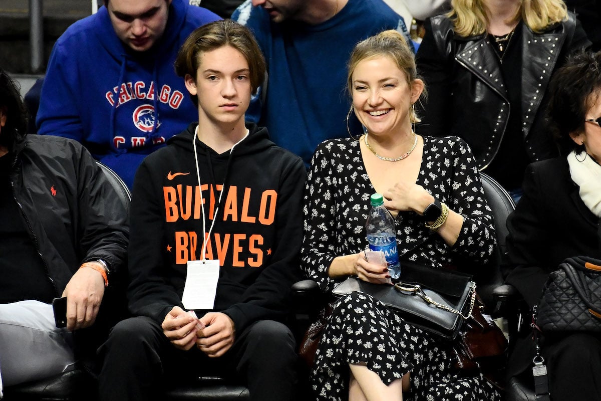 Kate Hudson and her son Ryder Robinson sit front row at a Clippers game