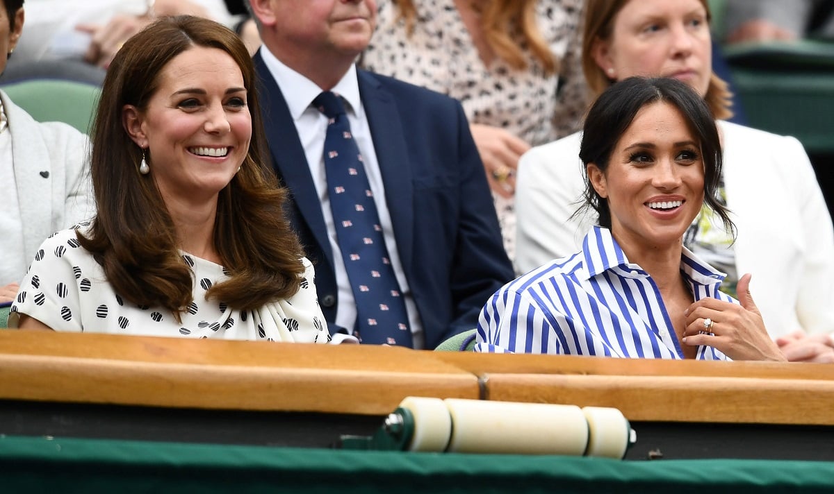 Kate Middleton and Meghan Markle attend day twelve of the Wimbledon Tennis Championships in 2018