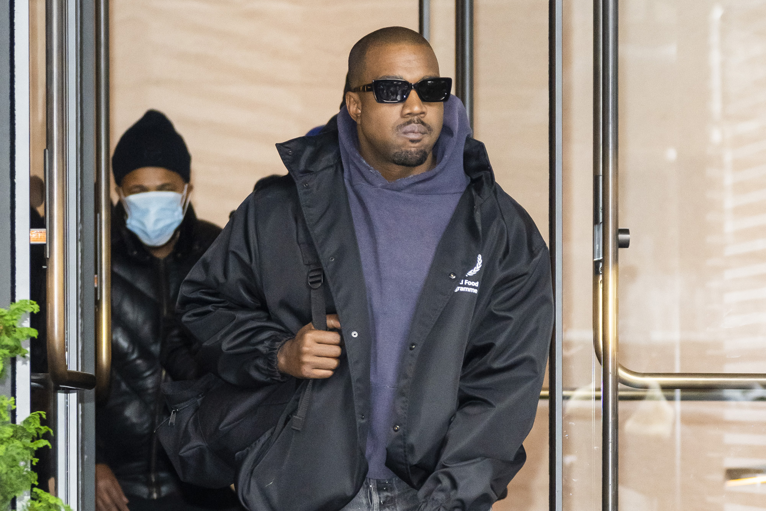 Kanye West is seen in Chelsea, New York dressed in a hoodie and black jacket