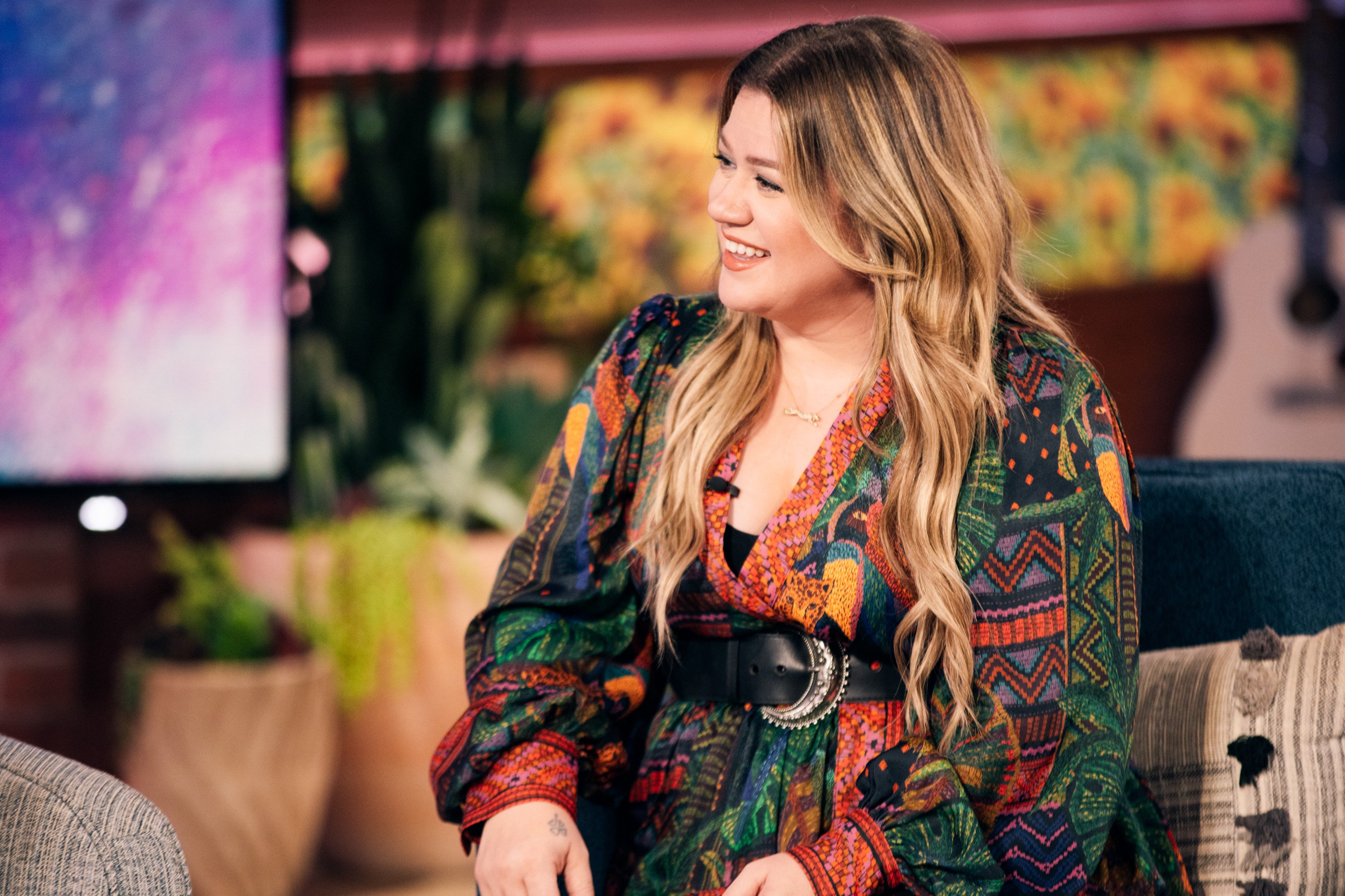 Kelly Clarkson on 'The Kelly Clarkson Show' smiling and looking to the side