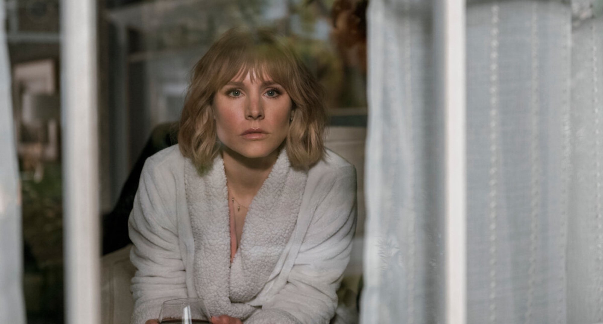 Kristen Bell as Anna in 'The Woman in the House Across the Street From the Girl in the Window' wearing robe in relation to creators and season 2.