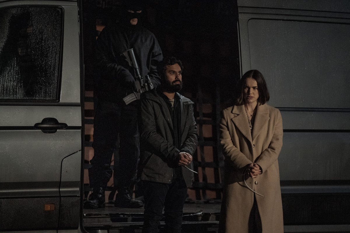 Kunal Nayyar and Elizabeth Henstridge stand with their hands tied in 'Suspicion' Season 1 Episode 4: 'The Devil You Know'