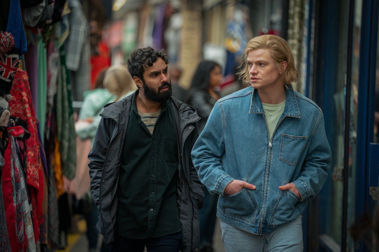 Kunal Nayyar and Tom Rhys-Harries walk next to each other in 'Suspicion' Season 1