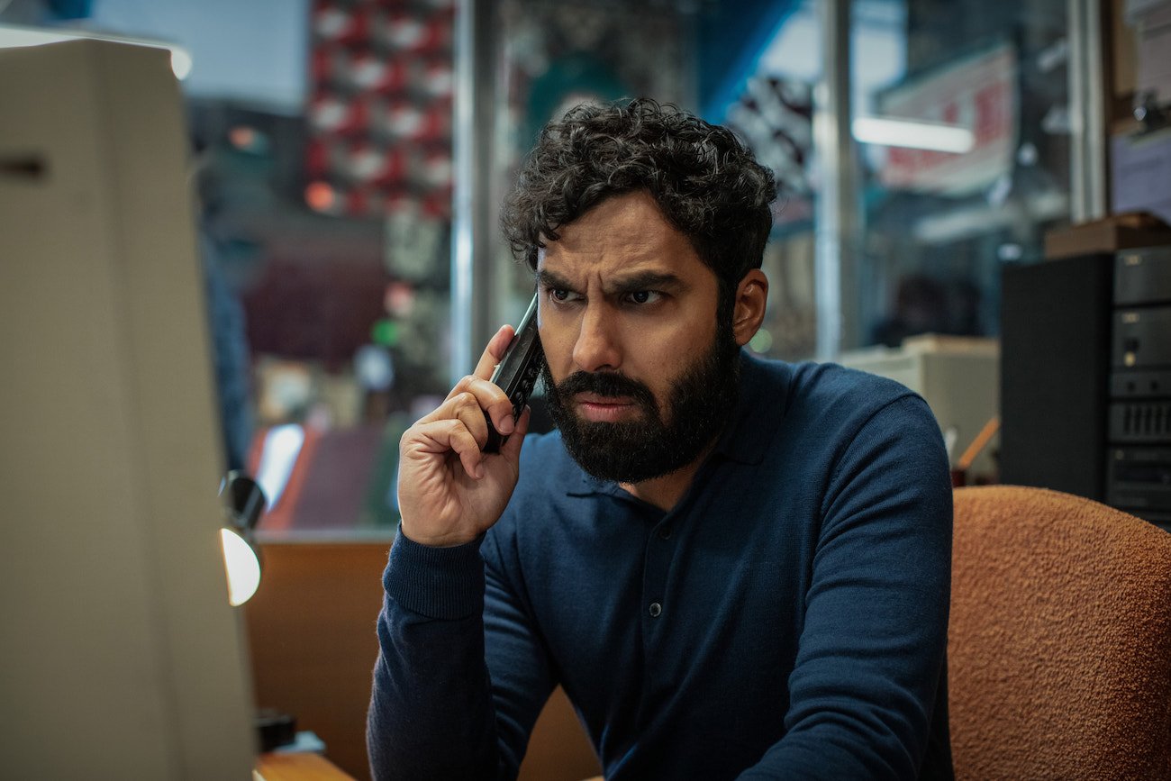 Kunal Nayyar holds a phone up to his ear in a scene from 'Suspicion' Season 1 Episode 1 'Persons of Interest'