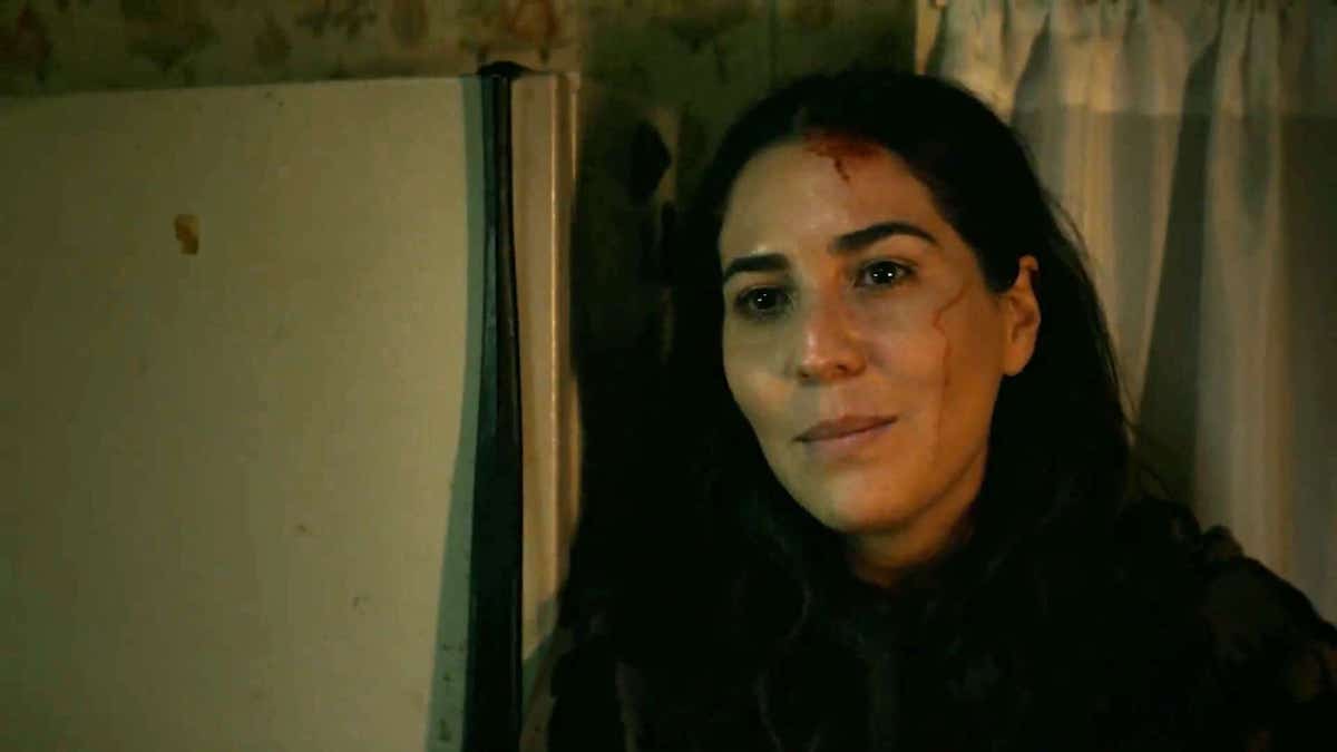 Audrey Esparza as Liliana wearing all black with blood on her face on 'Power Book IV: Force'