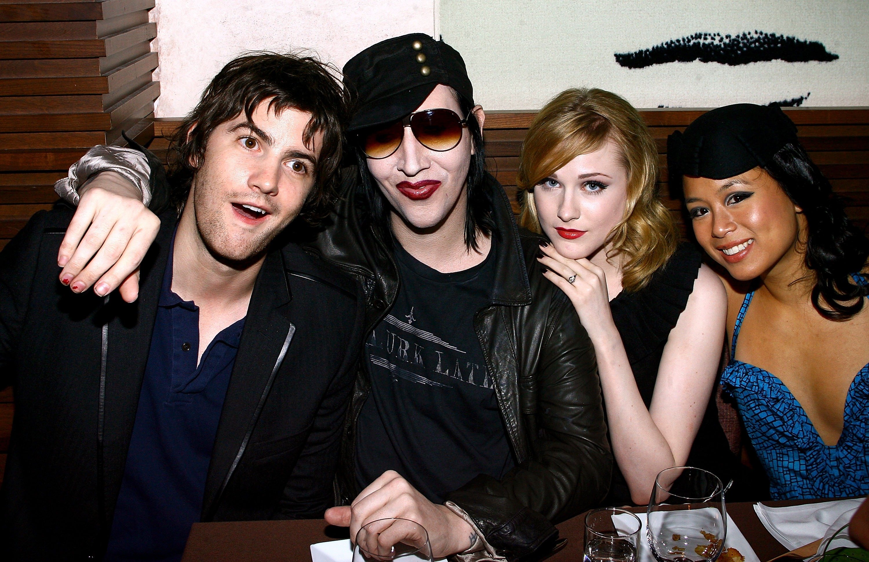 Actor Jim Sturgess, musician Marilyn Manson, actress Evan Rachel Wood and actress T.V. Carpio smile for cameras at the afterparty for 'Across The Universe' in 2007