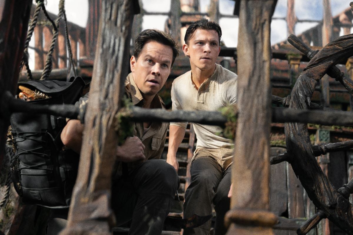 Mark Wahlberg and Tom Holland in 'Uncharted' hiding on a ship