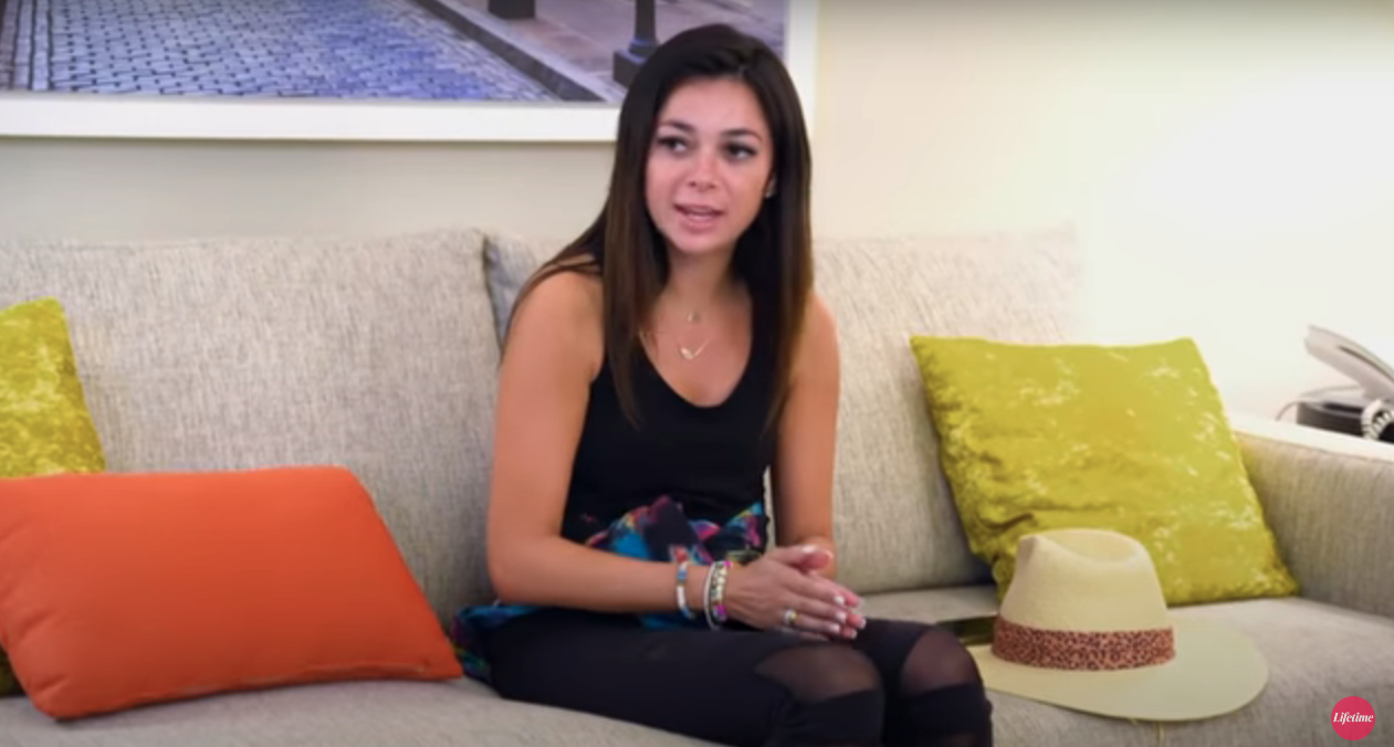 Alyssa sitting on a couch in an episode of 'Married at First Sight'