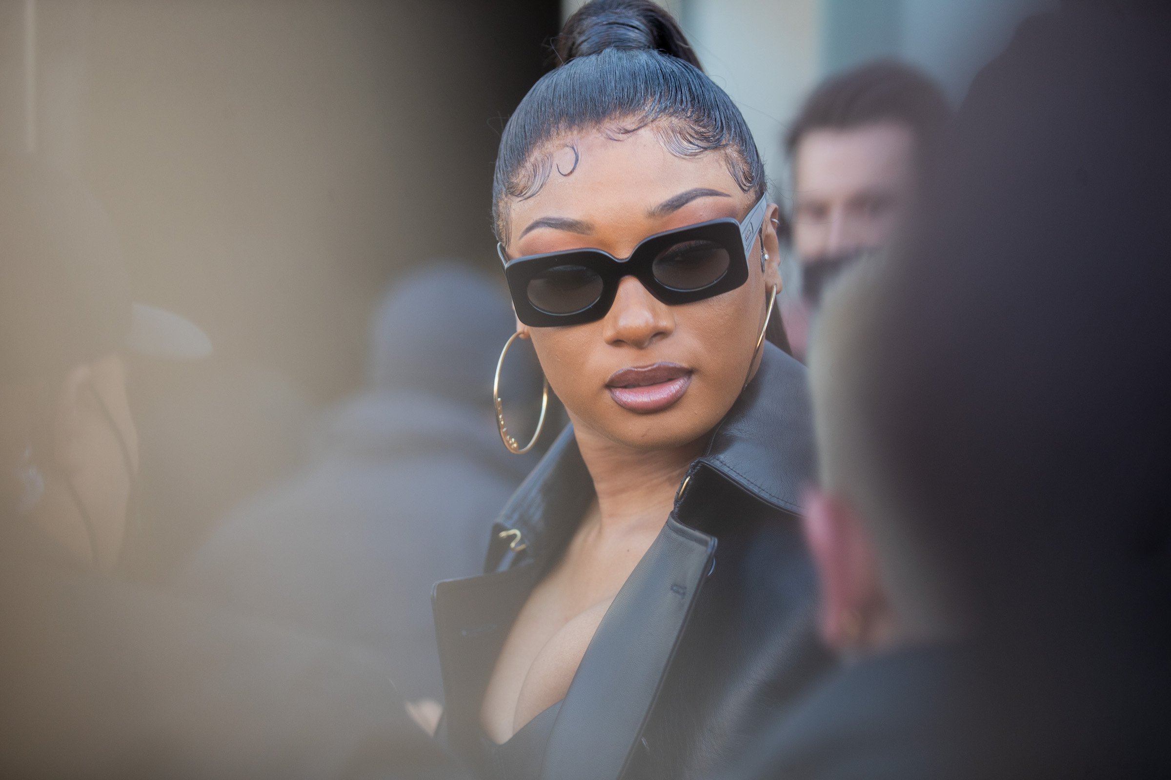 Megan Thee Stallion wearing sunglasses and all black