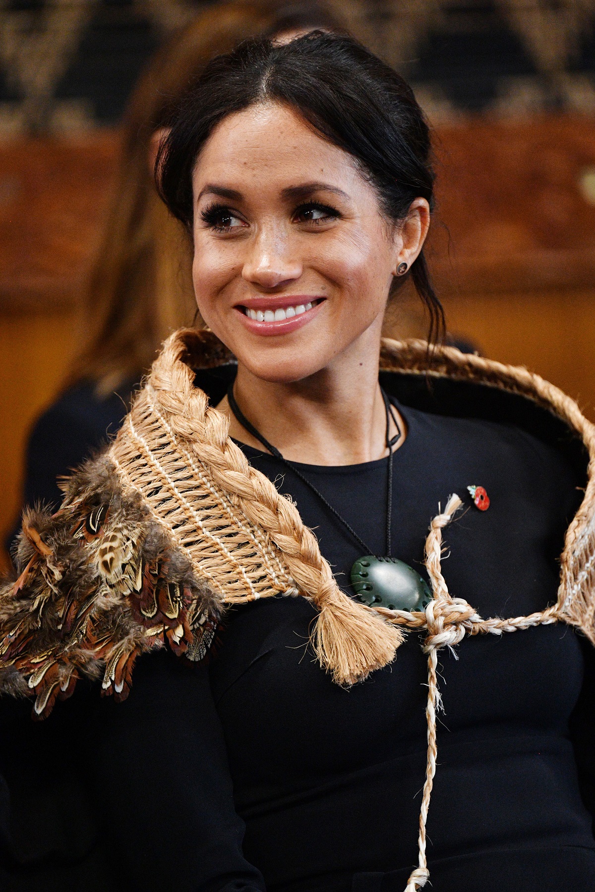 Meghan Markle smiling during visit to Te Papaiouru Marae for a formal powhiri and luncheon