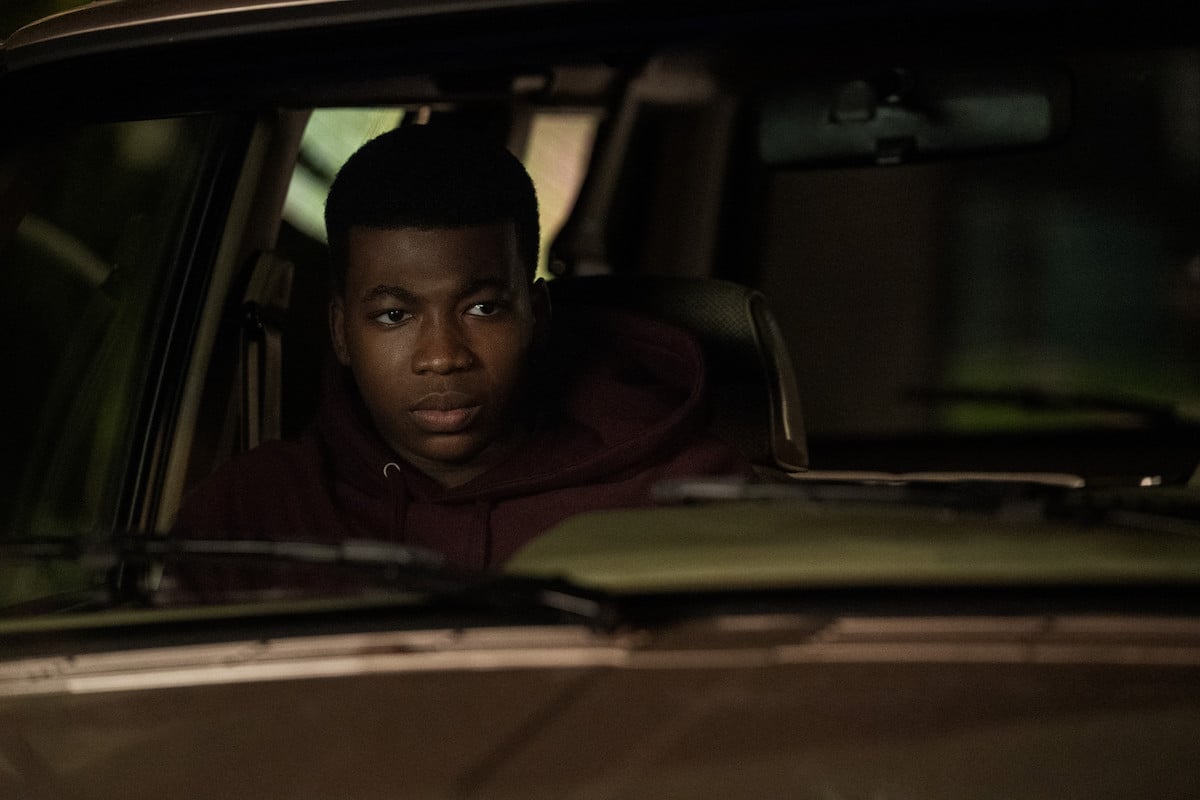 Mekai Curtis as Kanan Stark sitting in the car's passenger seat in 'Power Book III: Raising Kanan' |