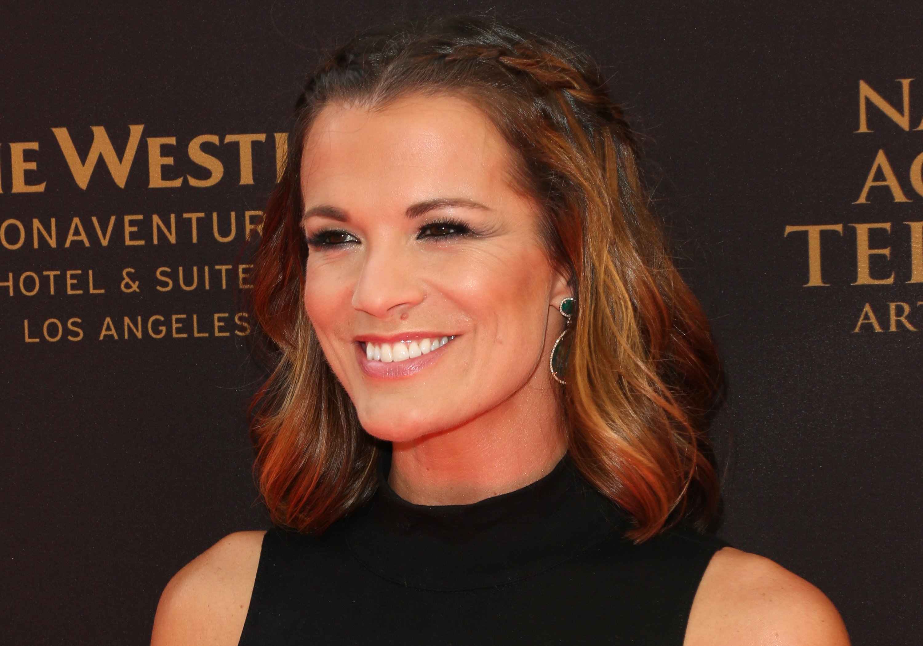 'The Young and the Restless' actor Melissa Claire Egan wearing a black dress during a red carpet appearance.