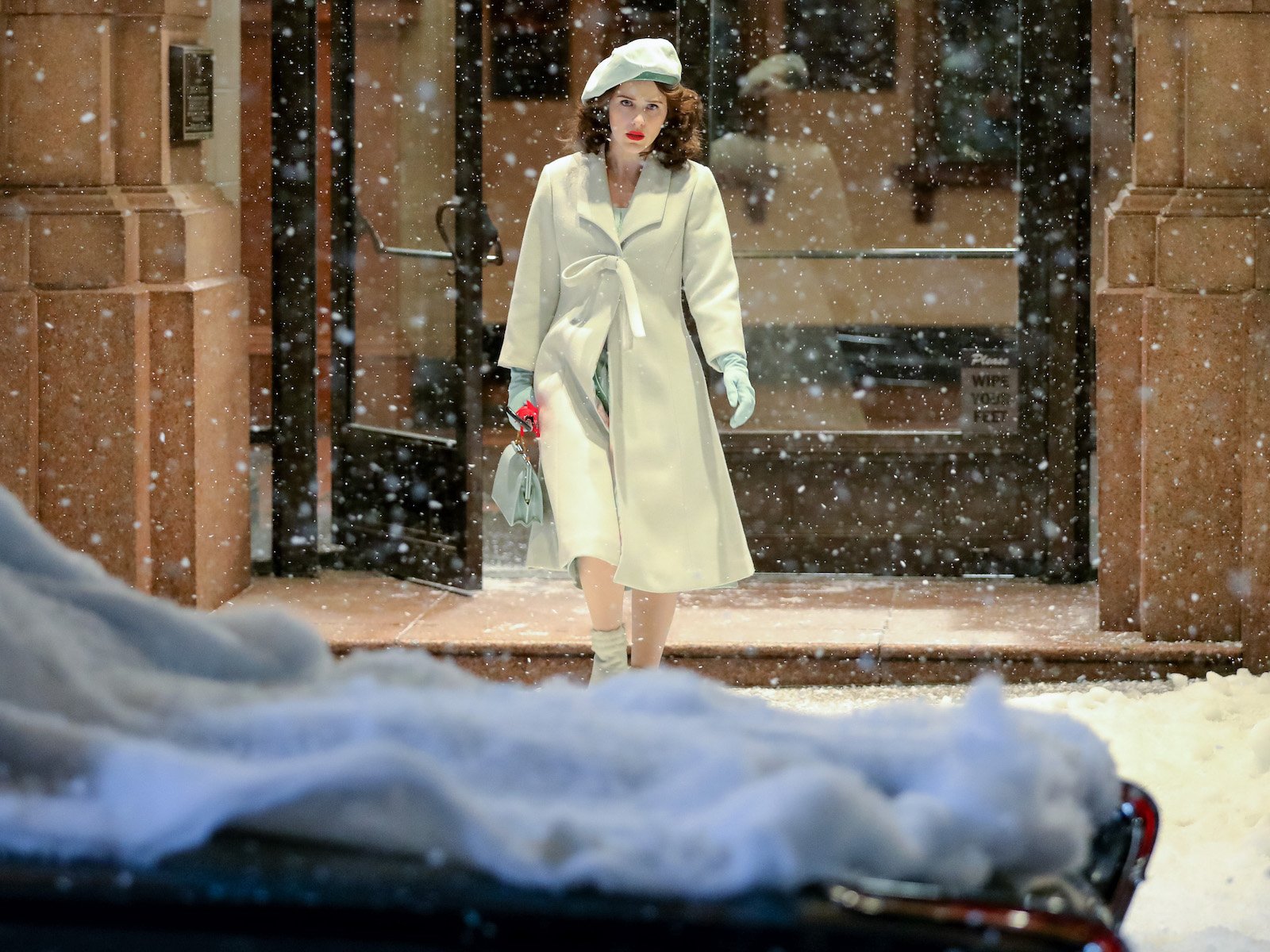 Rachel Brosnahan is seen at the film set of 'The Marvelous Mrs Maisel' leaving a hotel in the snow 